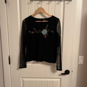 Black blouse with embroidery in the middle. Size large